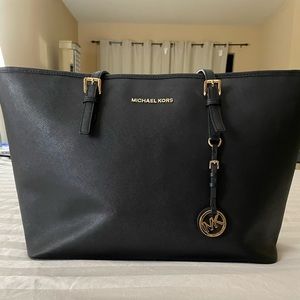 Black Michael Kors Saffiano tote with dust bag.